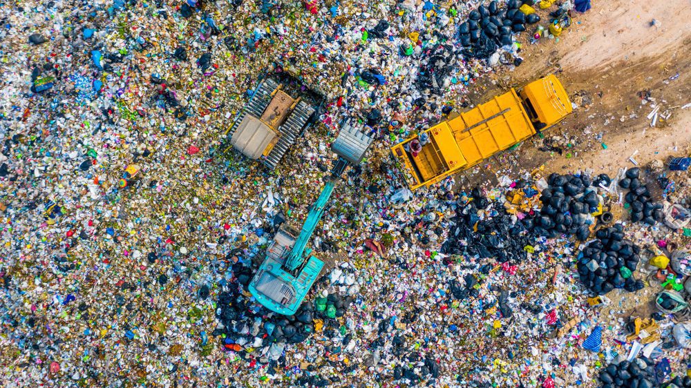 aerial view of landfill with trucks in it