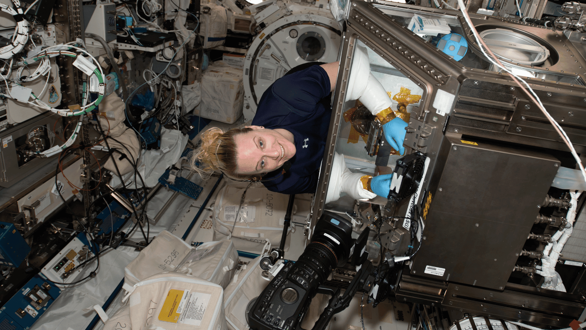 NASA astronaut Kate Rubins services samples for an earlier run of the biofilm study, which now looks at how spaceflight affects the formation of microbial biofilms