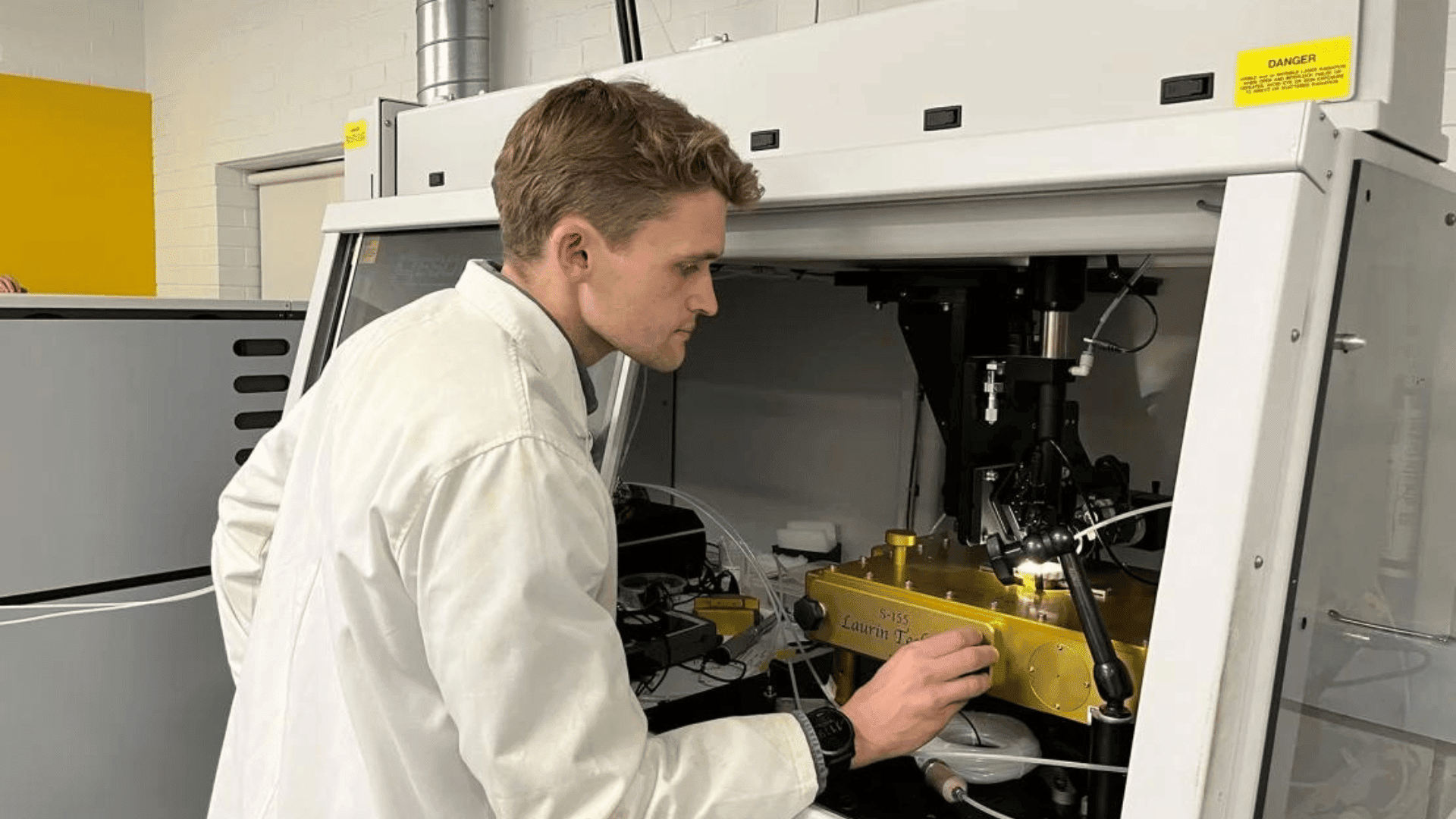 Curtin University doctoral student Anthony Clarke studies samples from the Altar Stone in the lab. Curtin University