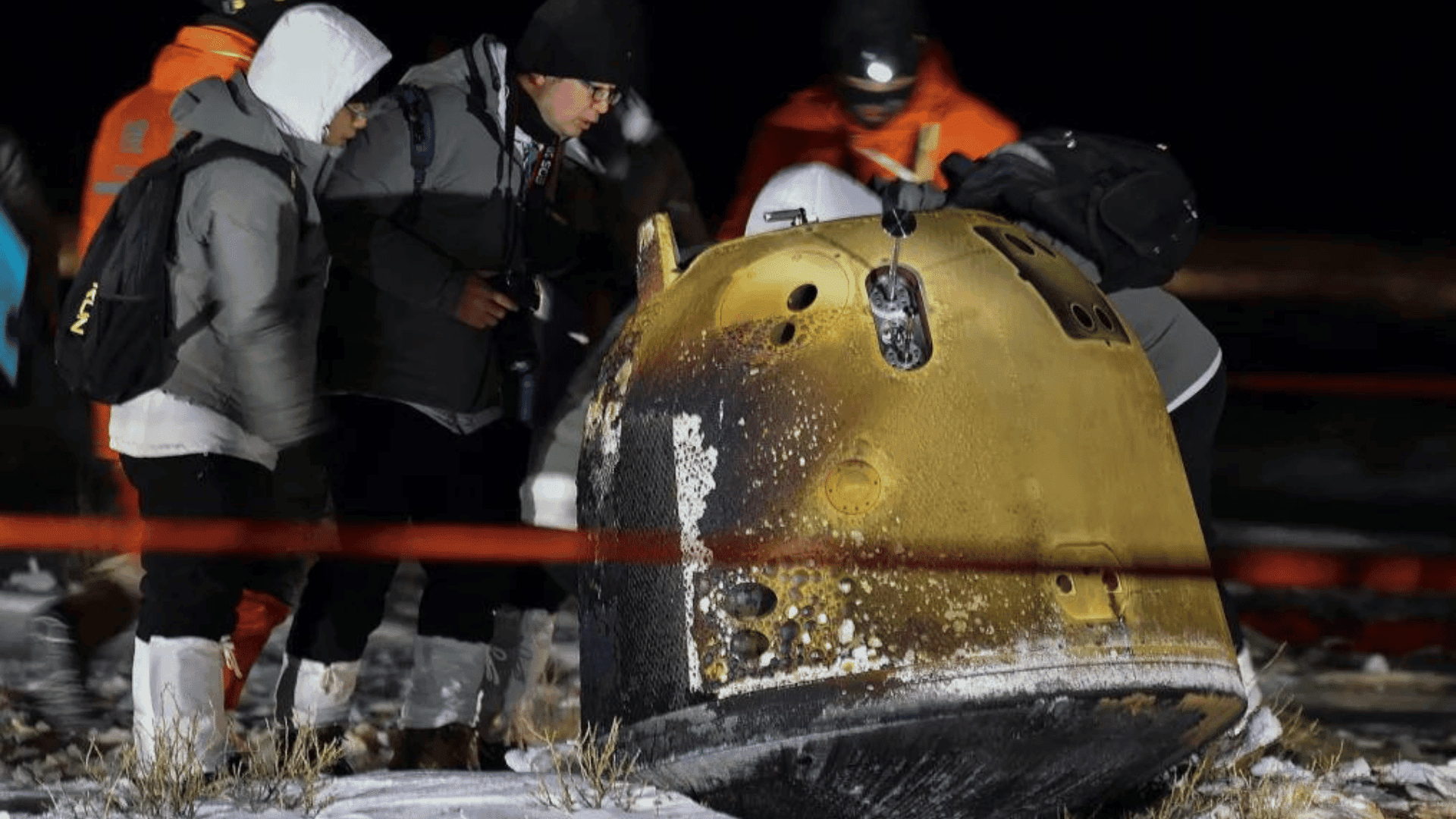 Recovery crew members inspect the Chang'e 5 probe after its successful return landing in northern China in December 2020. Ren Junchuan:Xinhua:AP:File