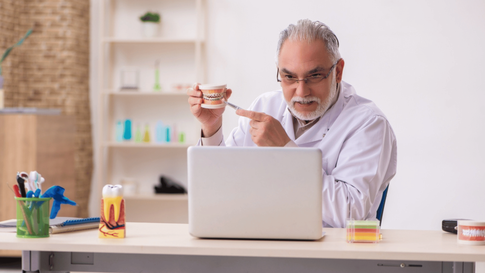 dentist speaking with patient remotely teledentistry